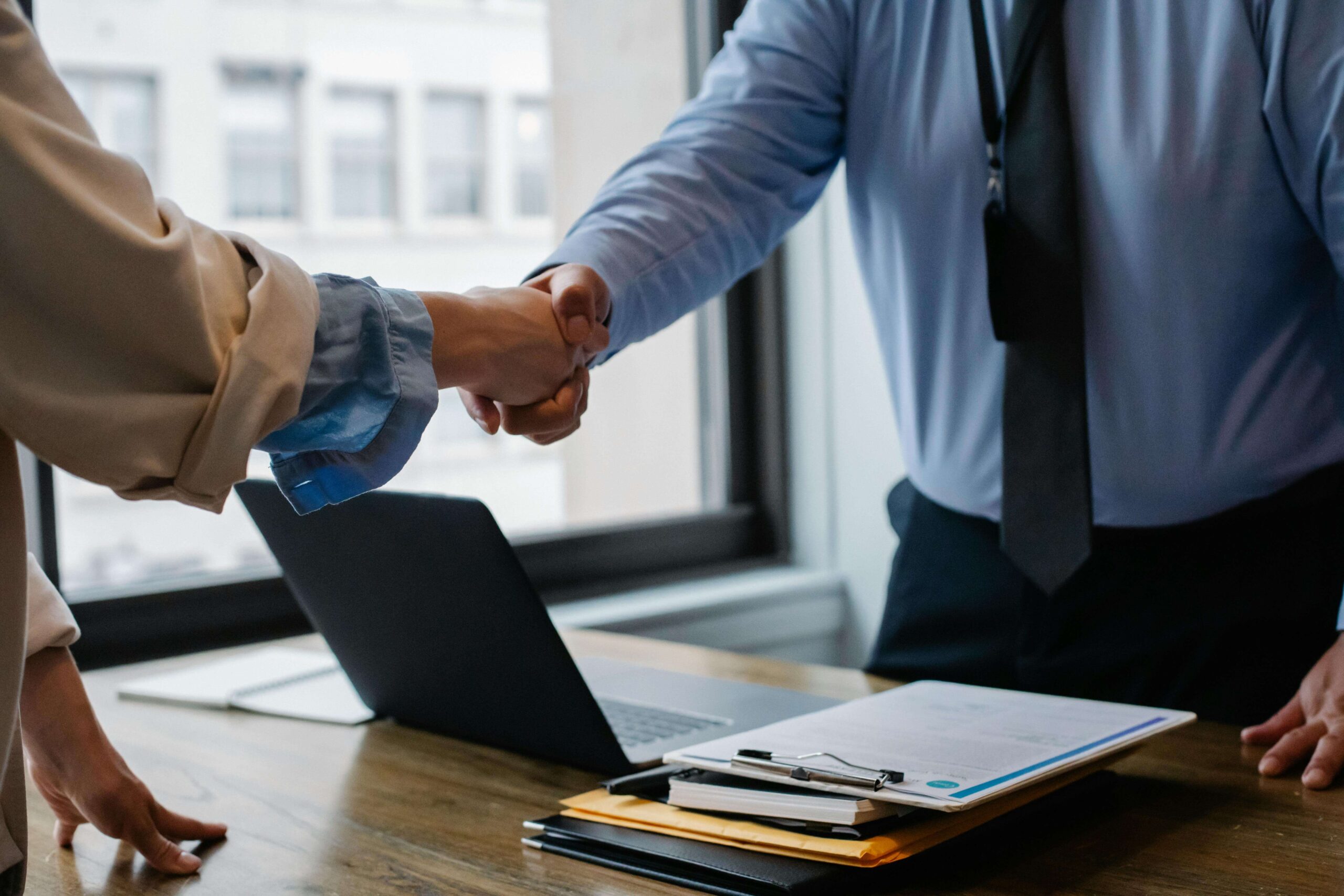 Business Partners Shake Hands to Secure Agreement.