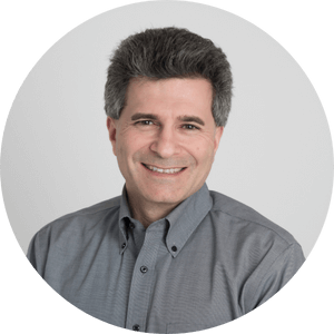 Circular cropped headshot of Eric Mitchellette, founder of Strategic Business Coach, Inc.